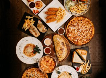 top-view-meals-tasty-yummy-different-pastries-dishes-brown-surface